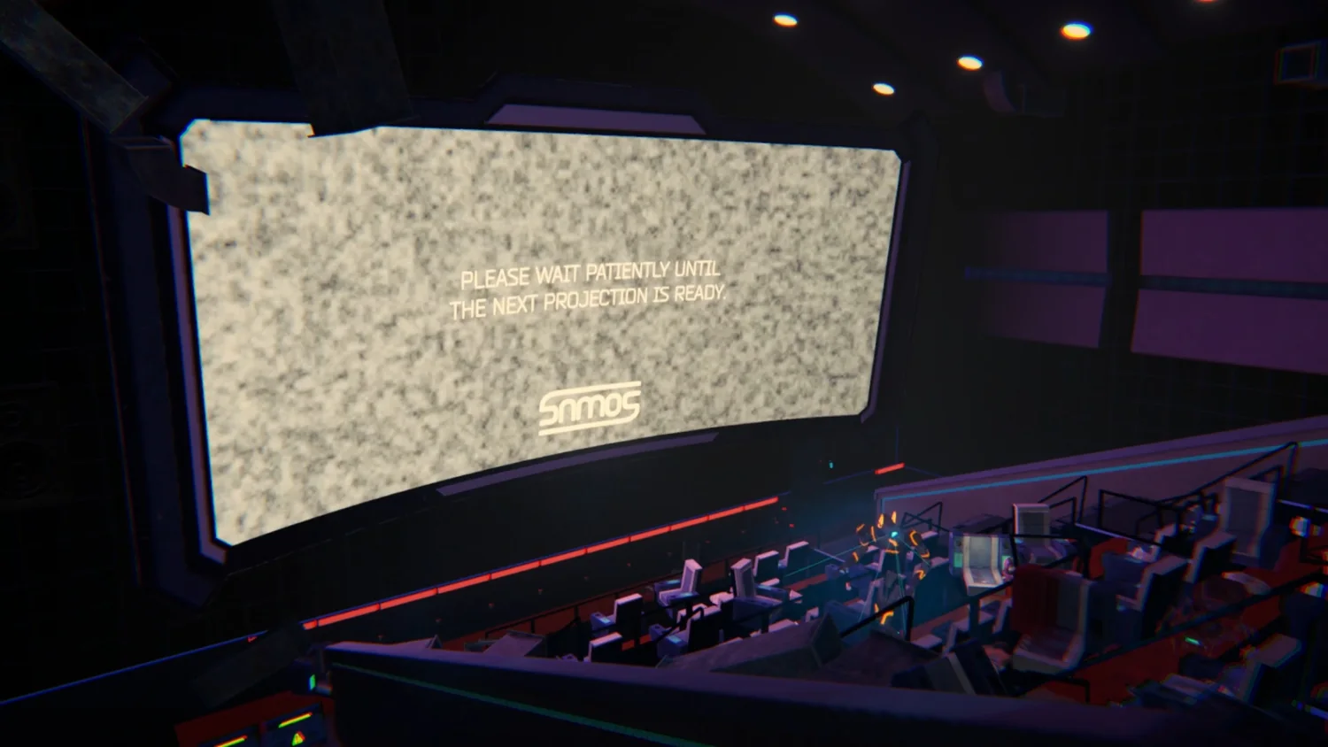 Rows of seats facing a huge glowing screen