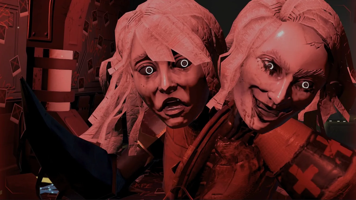 Two pale faces lit red, staring out of the dark